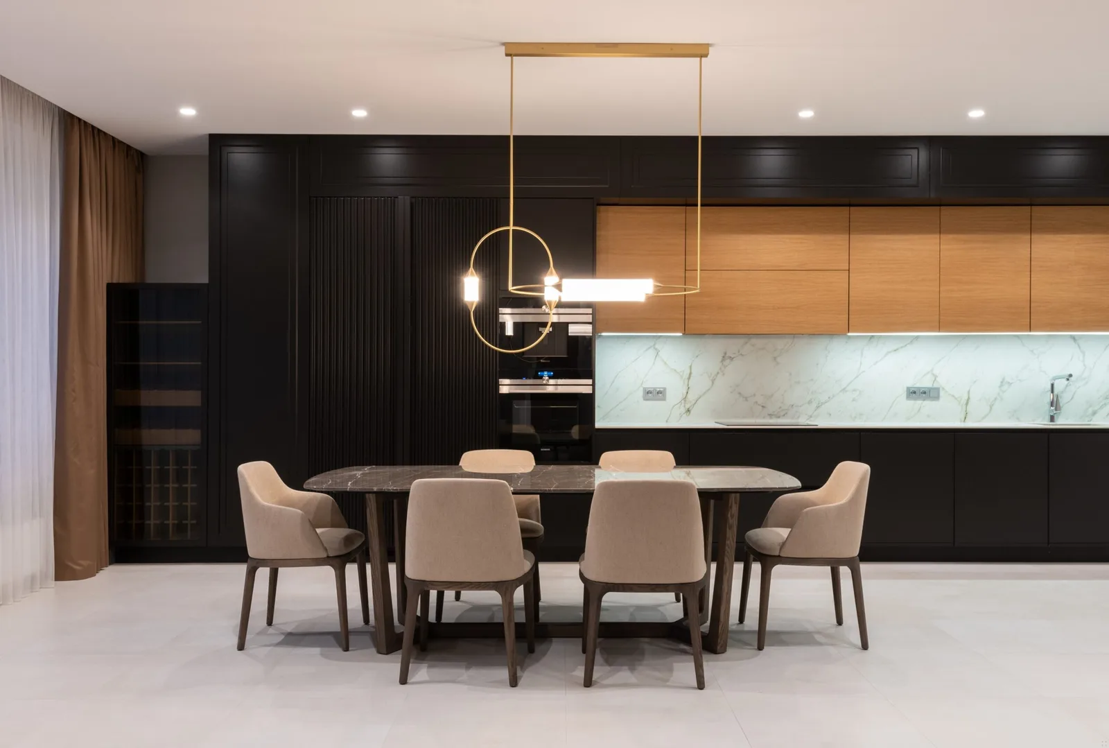 Black Cabinetry Kitchen with Calacatta Porcelain Splashback